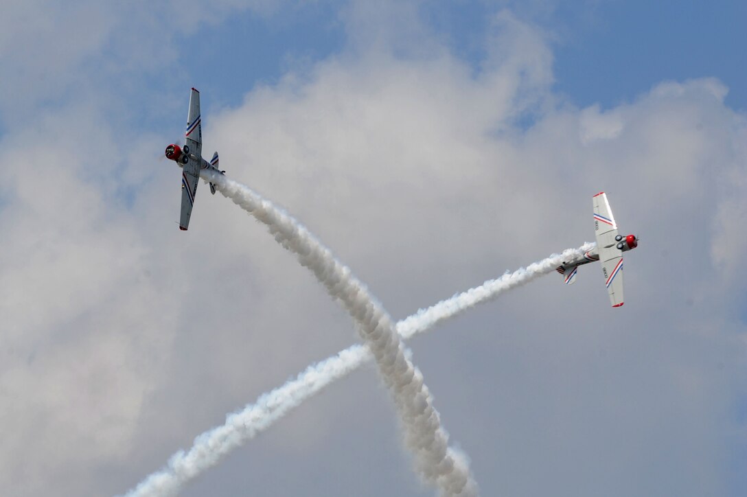 The GEICO Skytypers perform an aerial maneuver during the AirPower over Hampton Roads open house at Langley Air Force Base, Va., May 15, 2011. The first open house at Langley Air Force Base was held in 1919 and called an aerial circus. (U.S. Air Force photo by Airman 1st Class Racheal Watson)(RELEASED)