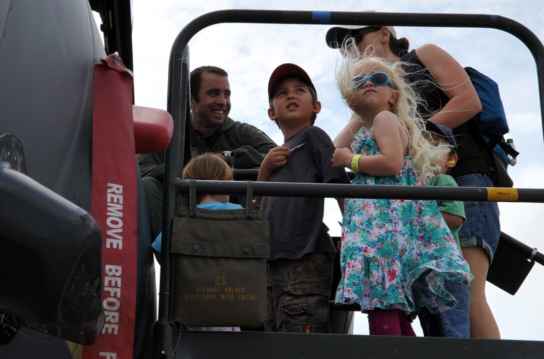 Capt. John “Deuces” Peltier, 333rd Fighter Squadron F-15 Eagle Pilot, shows spectators the cockpit of the F-15, during the AirPower over Hampton Roads open house at Langley Air Force Base, Va., May 15, 2011. The open house educates the public on past and present military aerial capabilities, increases recruiting and shows appreciation to the local community. (U.S. Air Force photo by Airman 1st Class Camilla Griffin/RELEASED)
