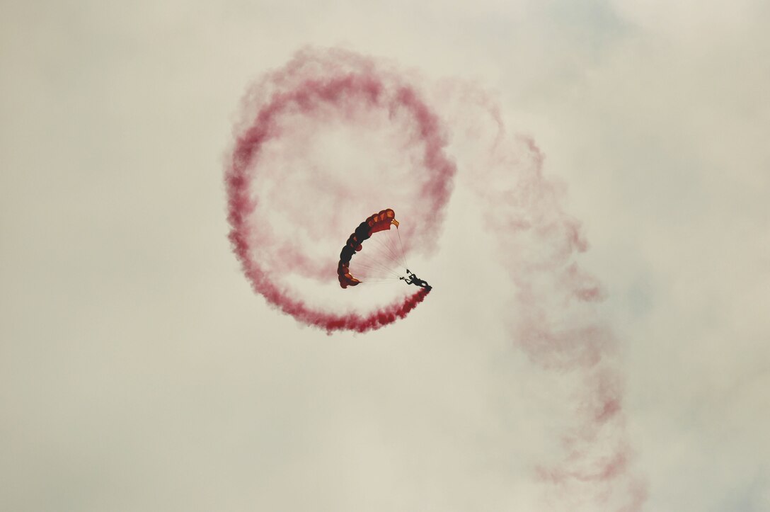 A Golden Knight spirals downward in a controlled aerial maneuver at the Air Power over Hampton Roads open house at Langley Air Force Base, Va., May 14, 2011. The Golden Knights have been wowing audiences at air shows, competitions, and high profile tandems for 50 years. (U.S. Air Force photo by Senior Airman Jonathan Muller)(RELEASED)