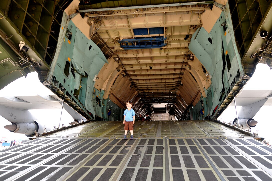 Conner Elling, from Falls Church Virginia, looks out from the rear entrance of a C-5 Galaxy transport aircraft at the Air Power over Hampton Roads open house at Langley Air Force Base, Va., May 14, 2011. The open house gives military and civilian personnel the opportunity to view various aircraft used by the military that they would not otherwise have a chance to experience. (U.S. Air Force photo by Senior Airman Jonathan Muller)(RELEASED)