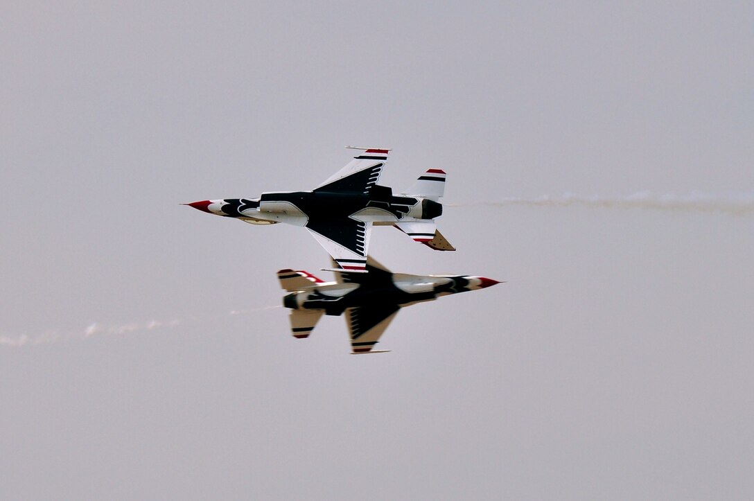 The U.S. Air Force Air Demonstration Squadron, Thunderbirds, demonstrate an Opposing Knife Edge Pass aerial maneuver at Langley Air Force Base, Va., May 14, 2011. The Thunderbirds headlined at Air Power over Hampton Roads open house and performed precision aerial maneuvers, demonstrating the capabilities of high performance aircraft to the Hampton Roads area. (U.S. Air Force photo by Senior Airman Jonathan Muller)(RELEASED)