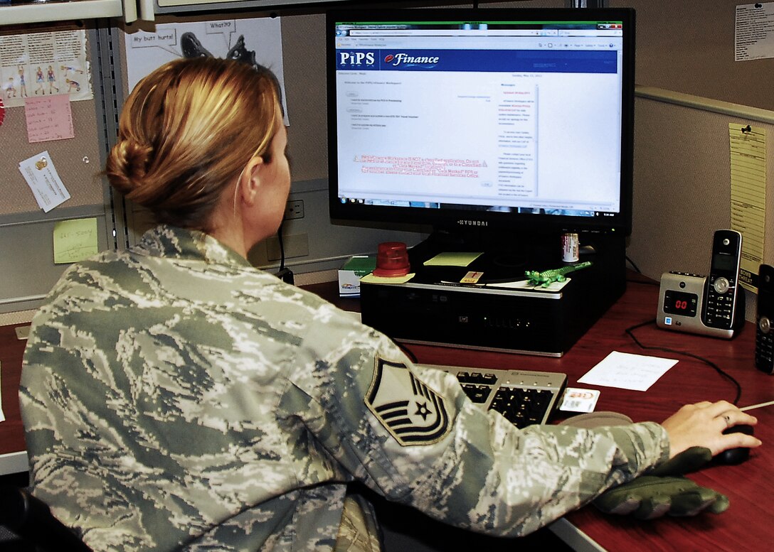 Master Sgt. Carrie Meyls, 403rd Wing education office, starts a new eFinance voucher.
(U.S. Air Force photo by Staff Sgt. Yolanda Addison)
