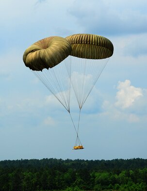 The G-12 equipment parachute packed by the 41st APS riggers drops on target. (U.S. Air Force photo by Staff. Sgt Yolanda Addison)