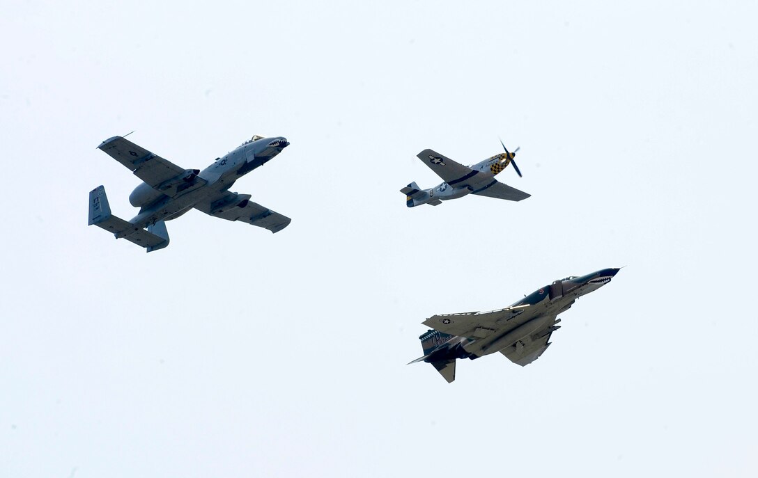 The Air Force Heritage Flight performs a fly by during the AirPower over Hampton Roads open house at Langley Air Force Base, Va., May 14, 2011. The U.S. Air Force Heritage Flight program presents the evolution of U.S. Air Force air power by flying today's state-of-the-art fighter aircraft in close formation with vintage fighter aircraft. (U.S. Air Force photo by Staff Sgt. Dana Hill)(RELEASED)