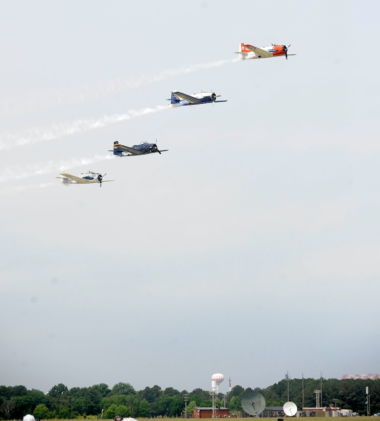 The Trojan Horsemen T-28 Warbirds Aerobatic Formation Demonstration Team performs aerial maneuvers during the AirPower over Hampton Roads open house at Langley Air Force Base, Va., May 14, 2011. The open house is a free three-day event featuring aerial demonstrations by modern and historical military aircraft and civilian performers. (U.S. Air Force photo by Staff Sgt. Dana Hill)(RELEASED)