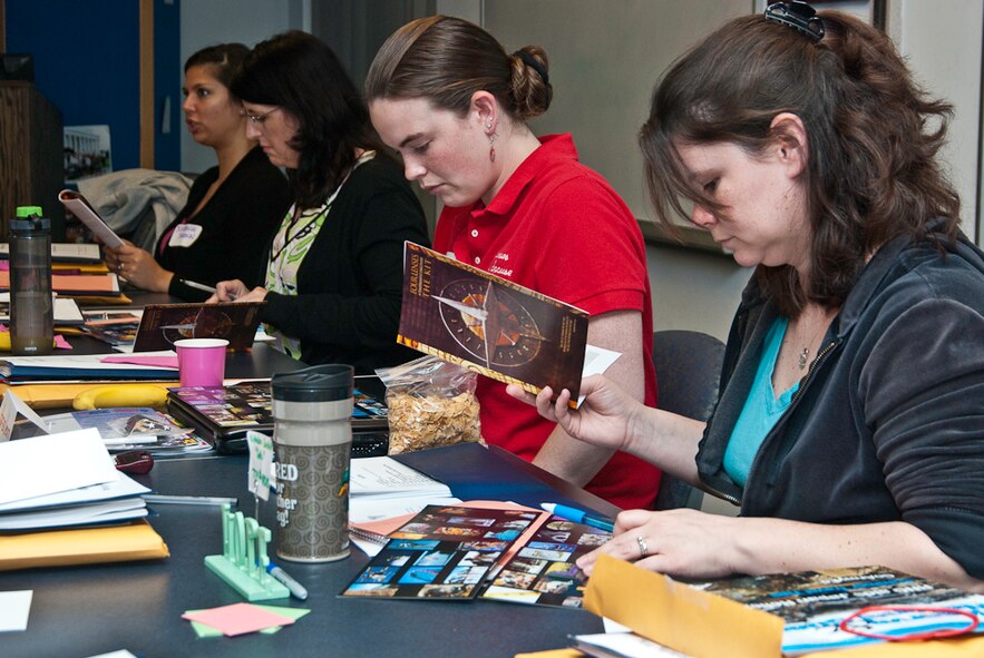 JOINT BASE ANDREWS - (Left to right) Rochelle Brown, Megan Schuliger, Heather Umstattd and Katie Berhiet, spouses of 459th Air Refueling Airmen, participate in a self-discovery exercise called Four Lenses to improve their interpersonal skills to assist others. The exercise is part of the Key Spouse Program initial training that was held here May 14. The Key Spouse Program at the 459 ARW supports Airmen and their families during deployments, separations and emergencies, as well as enhancing and encouraging regular communication between units and families. (U.S. Air Force photo/Staff Sgt. Sophia Piellusch)