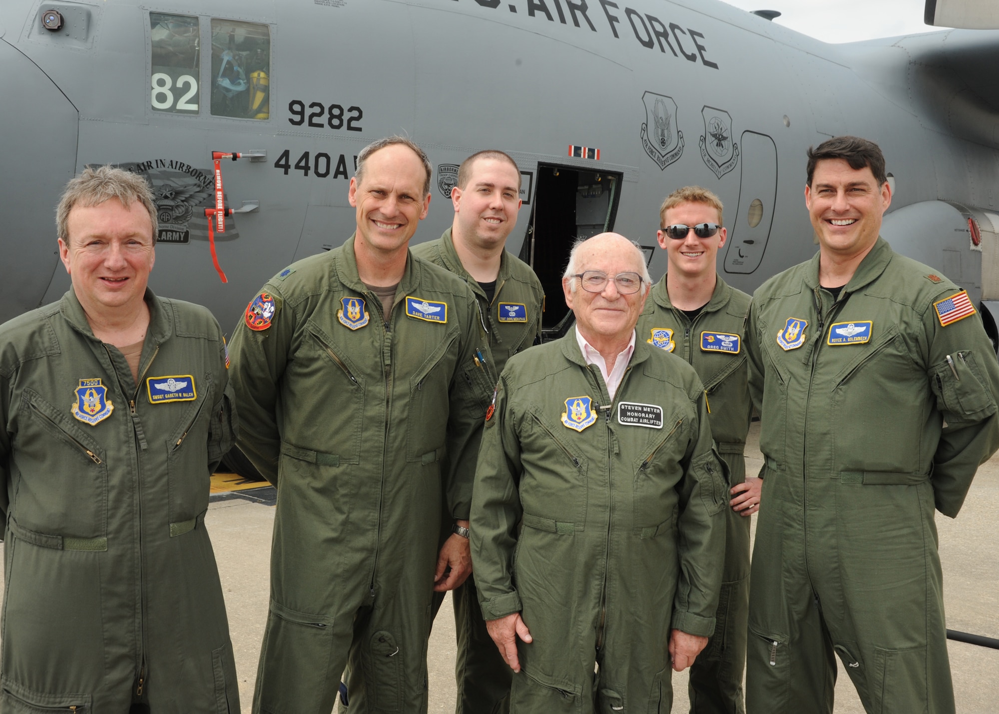 Steven Meyer, a World War II veteran, poses with the crew of the C-130H aircraft he marshaled into its parking location at Pope Field, N.C., on May 13, 2011.  Pictured from left to right are: Senior Master Sgt. Gareth Balch, Loadmaster, Lt. Col. Dave Tarter, pilot, Tech. Sgt. Chris Menapace, Flight Engineer,  Mr. Steven Meyer, 1st Lt. Greg Smith, Navigator and Maj. Royce Golembeck, Copilot.  Meyer served as a combat engineer in the European Theater of Operations and assited in the planning of the D-Day invasion at Normandy.  The event was coordinated through Jeremy Bloom’s Wish of a Lifetime foundation, Brookdale Senior Living and the Airmen of the 440th Airlift Wing.  “This is beyond my wildest dreams,” said Meyer, “and, by all accounts my reviews were very positive.  I believe I did quite well.”  (U.S. Air Force photo by Staff Sgt. Peter R. Miller)