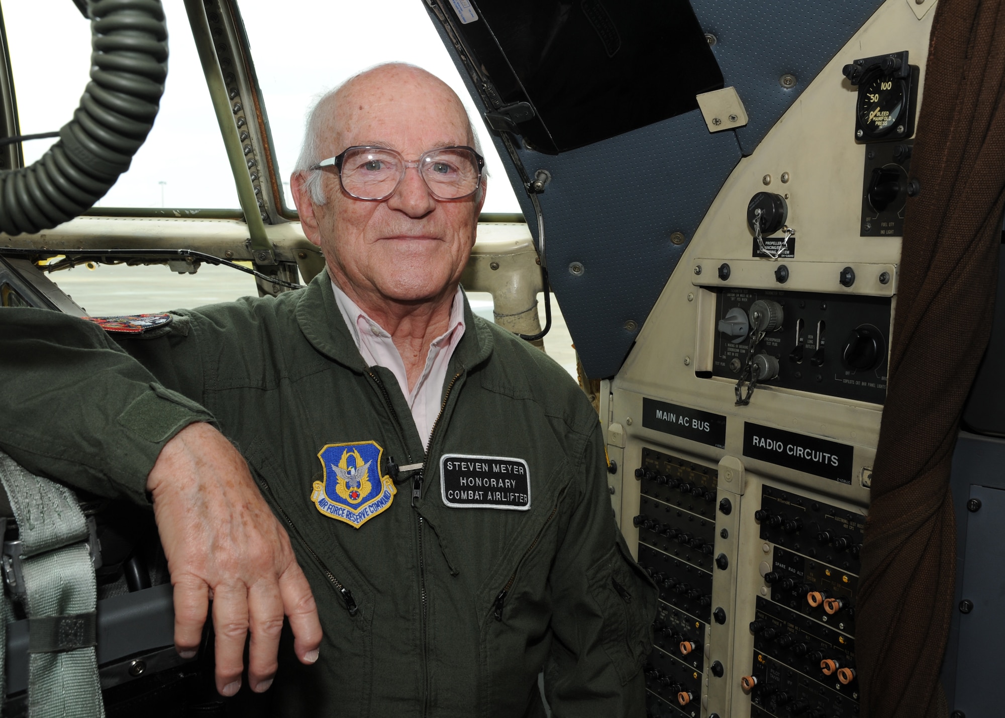 Steven Meyer, a World War II veteran, poses for a picture in the C-130H cockpit after he celebrated his 89th birthday and lifelong dream to marshal an aircraft into its parking location on Pope Field’s flightline on May 13, 2011.  Meyer served as a combat engineer in the European Theater of Operations and assisted in the planning of the D-Day invasion at Normandy.  The event was coordinated through Jeremy Bloom’s Wish of a Lifetime foundation, Brookdale Senior Living and the Airmen of the 440th Airlift Wing.   “This is beyond my wildest dreams,” said Meyer, “and, by all accounts my reviews were very positive.  I believe I did quite well.”  (U.S. Air Force photo by Staff Sgt. Peter R. Miller)