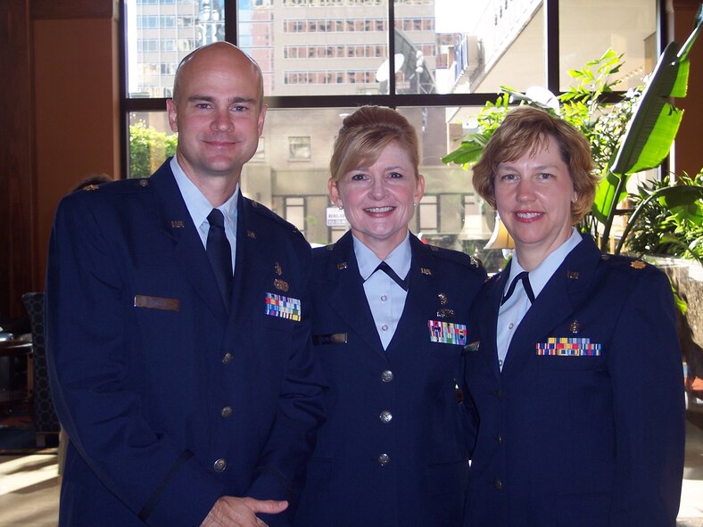 (from left) Maj. Chris Howell and Maj. Carolyn Congleton flank Col. Diana Shoop, 123rd Medical Squadron commander, in Minneapolis where they were recognized as the top medical officers in thier respective fields.  Major Howell was named the Air National Guard Phsician Assistant of the yearh and Major Congleton was named the ANG Public Health Officer of the year. Both were recognized for additional service outside of their standard job duties. (Courtesy photo)