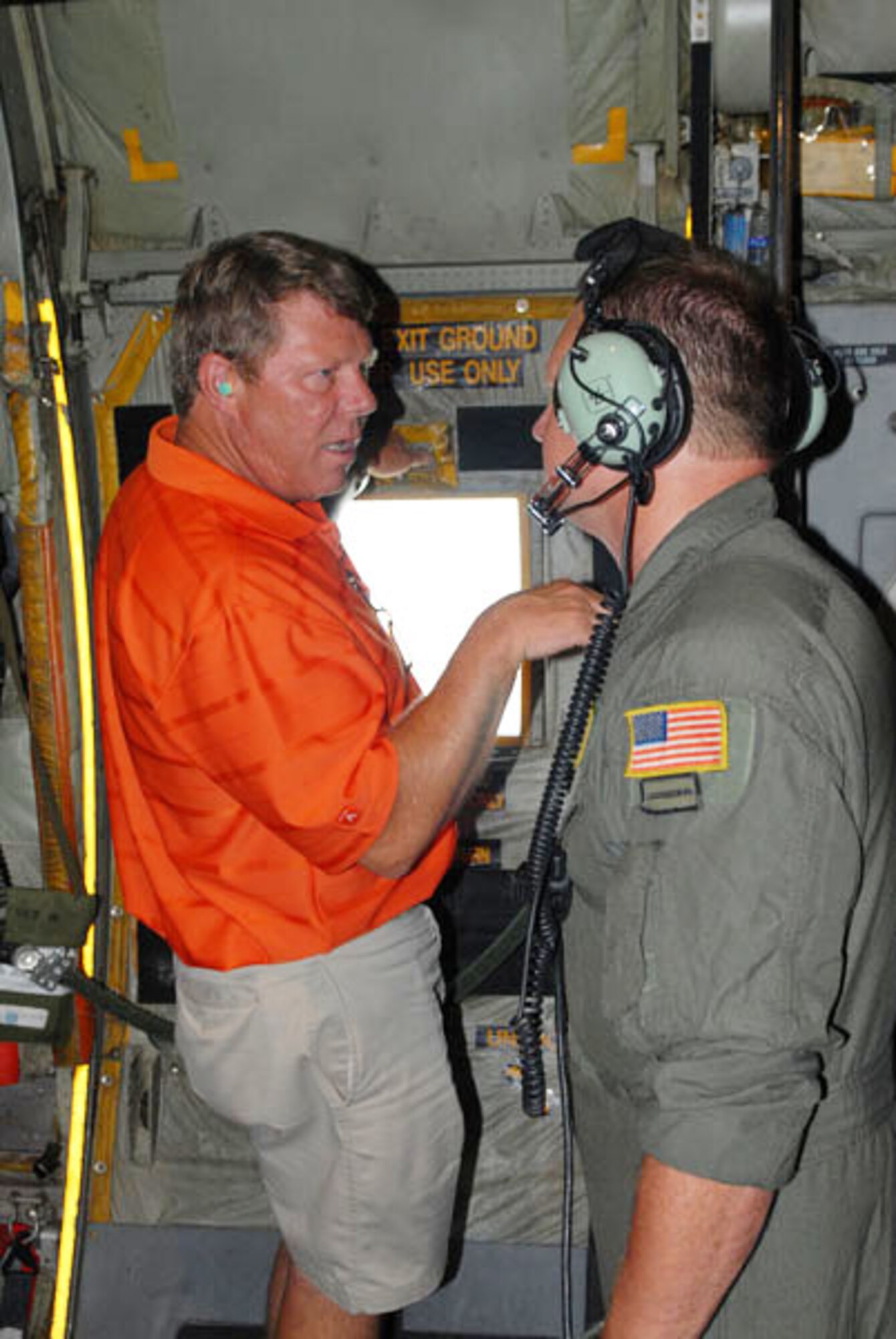 Master Sgt. Eric Hagen, a loadmaster with the Kentucky Air National Guard 123rd Airlift Wing, Louisville, Ky., discusses flight operations with a Kentucky civic leader during "Boss Lift" Aug. 13, 2010.  The event, sponsored by Employers Support of the Guard and Reserve, is designed to foster support and understanding of the duties, training, and military life National Guard and Reserve troops experience. (Photo by Army Spc. Scott Raper)