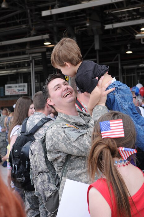 Spc. Allen Anderson from the 19th Special Forces Group, Utah National Guard, greets his son Ethan after returning from a year-long deployment to Iraq. More than 100 members of the unit returned to the Utah Air National Guard Base in Salt Lake City on May 13, 2011. U.S. Air Force photo by Tech. Sgt. Jeremy Giacoletto-Stegall (RELEASED)