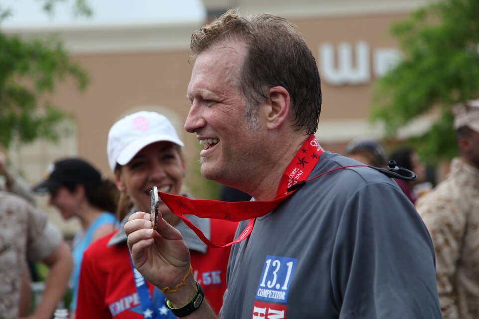 Drew Carey an actor, comedian and Marine who served in the Marine Corps Reserve from 1981-1987 was the official starter of this year’s Marine Corps Marathon Historic Half in Fredericksburg, Va., May 14. Carey met his goal of running the half marathon in under 2 hours and finished with a time of 1 hour, 57 minutes and 2 seconds.::r::::n::