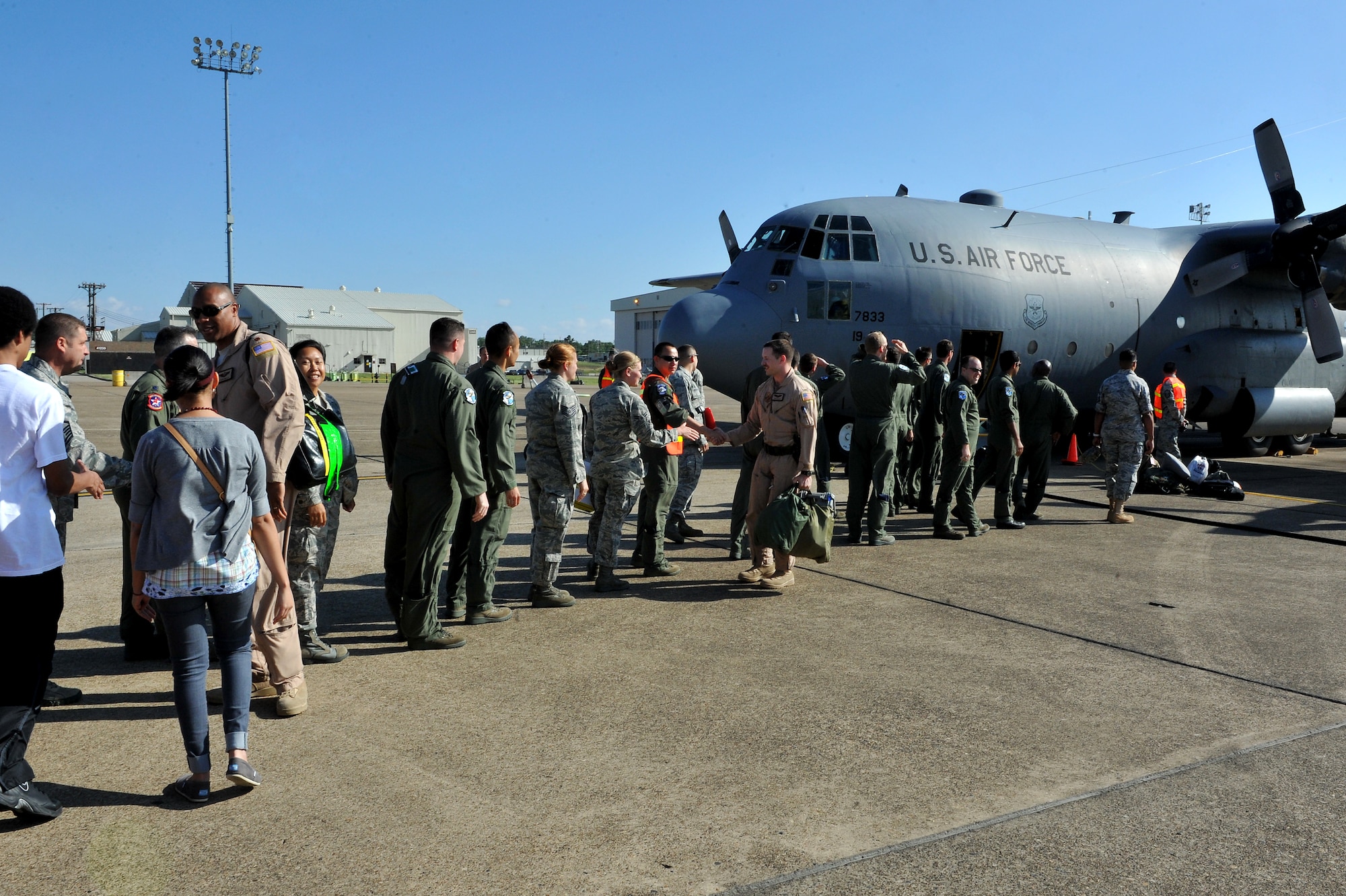 Friends and family members gather May 13, 2011, at the flightline on Little Rock Air Force Base, Ark, to welcome home approximately 50 Airmen from support operations in Southwest Asia. The Airmen arrived in C-130 aircraft, returning from operations at Joint Base Balad, Iraq. (U.S. Air Force photo/Staff Sgt. Chris Willis)