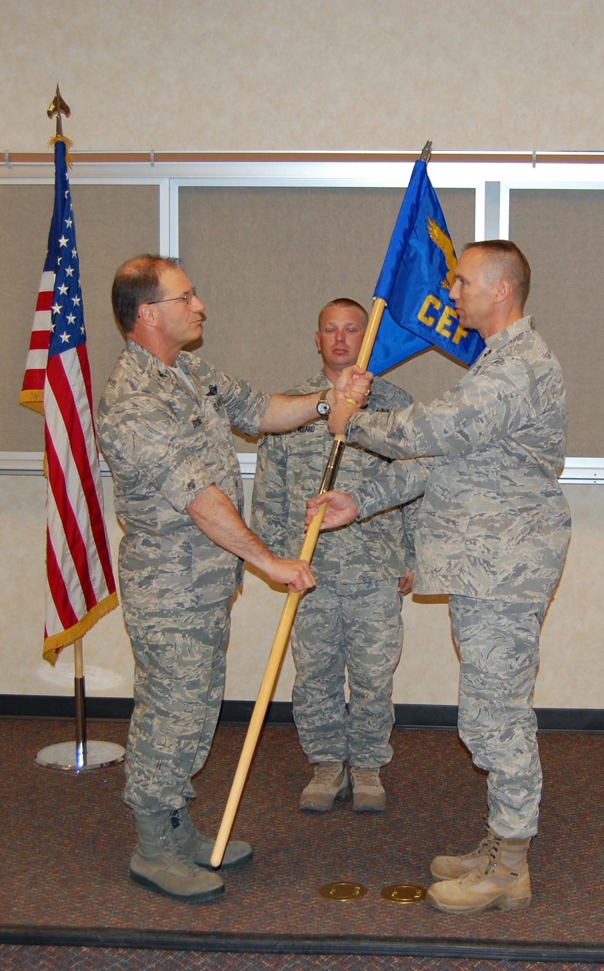 NELLIS AIR FORCE BASE, Nev. - (Right) Capt. Daniel Tufts, 926th Civil Engineer Flight commander, receives the guideon from Col. Herman Brunke, Jr., 926th Group commander, during an appointment of command ceremony here April 14. (U.S. Air Force photo/Capt. Jessica Martin)