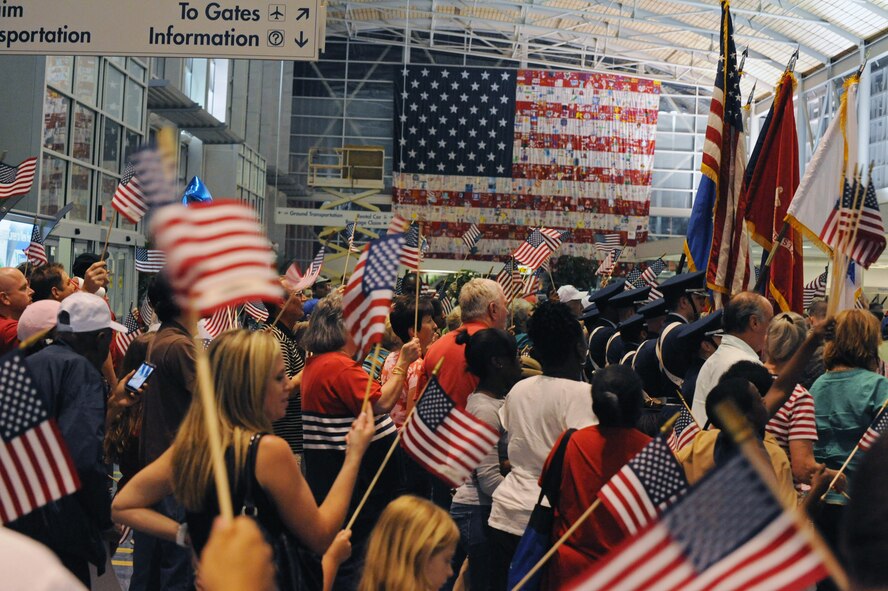 World War II veterans receive a pleasant "welcome home" after returning from a trip to Washington D.C. at the Shreveport Regional Airport in Shreveport, La., May 12. The veterans visited the capital to see the World War II monument for their first time. Barksdale and the local community welcomed the veterans home to show support and gratitude. (U.S. Air Force photo/Airman 1st Class Micaiah Anthony)(RELEASED)