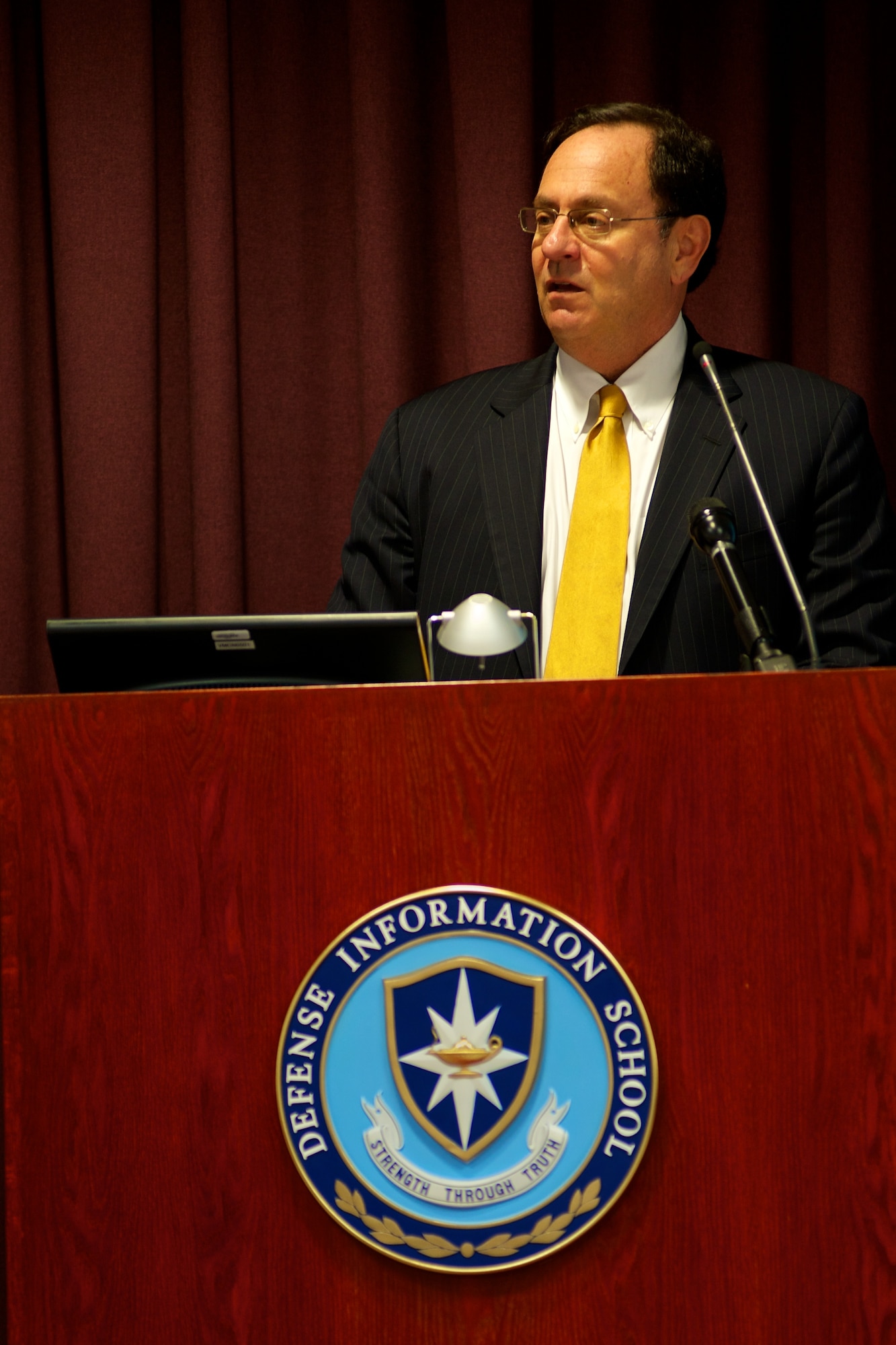 Douglas B. Wilson, assistant secretary of defense for public affairs, speaks at the 2011 Communicators of Excellence awards ceremony May 13, 2011, at the Defense Information School at Fort Meade, Md. U.S Air Force photo by Staff Sgt. Joshua T. Jasper  