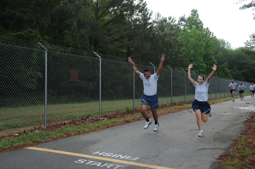 Airmen from the 916th Air Refueling Wing near the finish at the wing's semi-annual Warrior Run on May 15. Nearly 200 Airmen participated in the two-mile morale event. (USAF photo by Staff Sgt. Terrica Jones, 916ARW/PA)