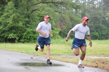 Col. Timothy Lamb, commander of the 567th RED HORSE Squadron, races one his Airmen to the finish during the 916th's semi-annual Warrior Run on Sunday, May 15. (USAF photo by TSgt. Scotty Sweatt)