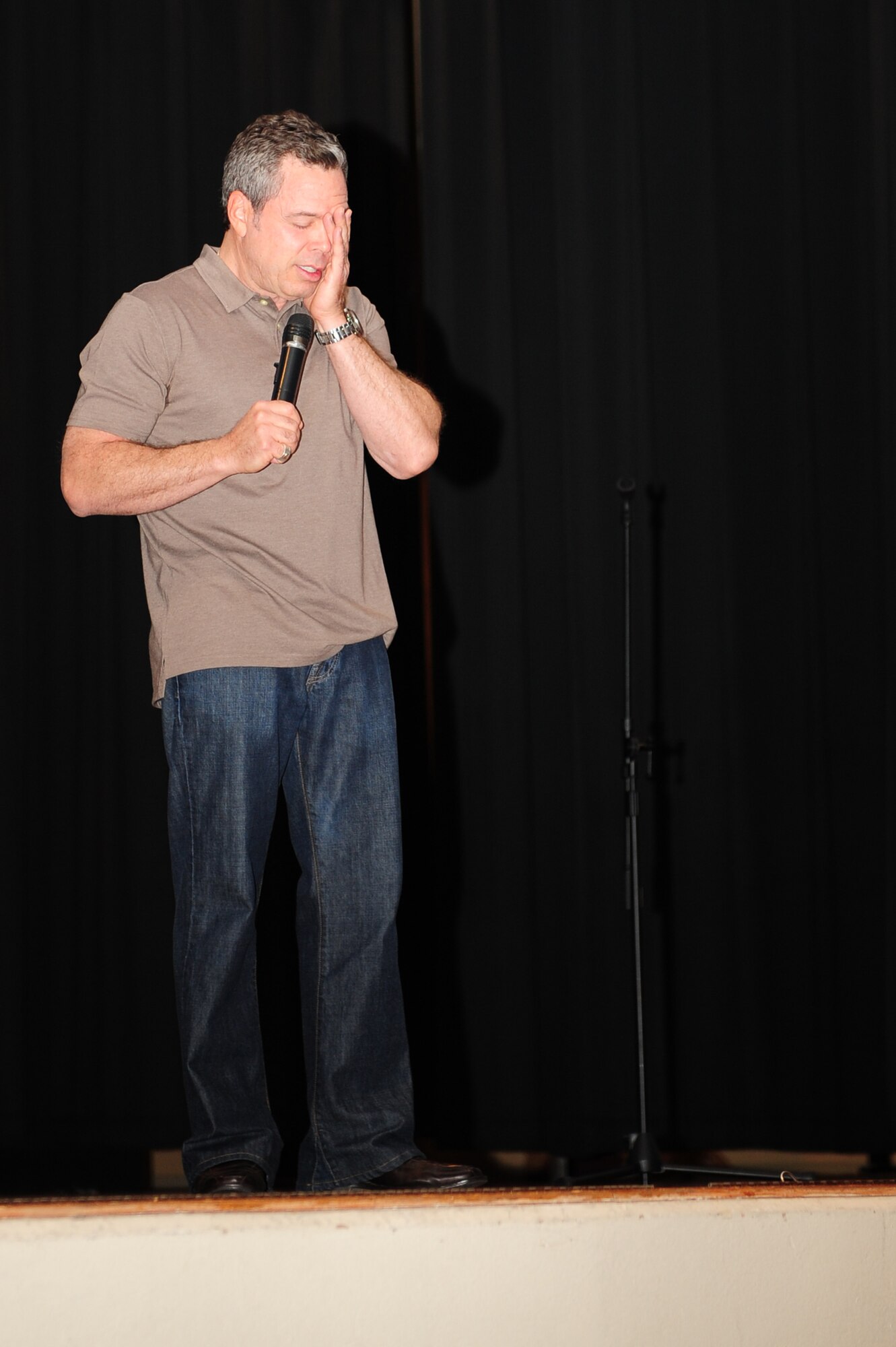 Comedian Bernie McGrenahan performs his Happy Hour comedy tour May 16, 2011 at Scott Air Force Base, Ill. The show provided comedy with a twist as a safety and prevention message was given along with the laughs. (U.S. Air Force photo by Staff Sgt. Teresa Jennings)