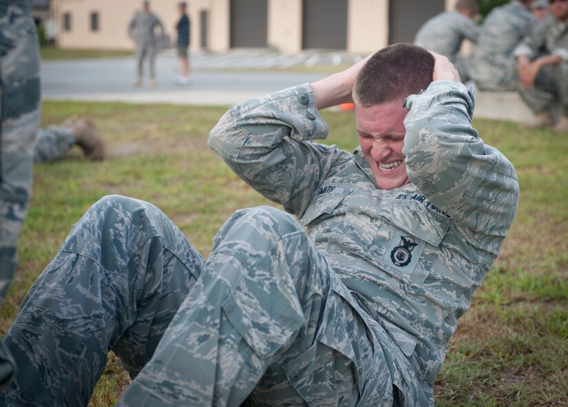MOODY AIR FORCE BASE, Ga -- Airman 1st Class Ricky Smith, 822nd Base Defense Squadron fire team member, performs sit ups during the physical training portion of the Warrior Challenge May 14. Airman Smith completed 171 sit ups before stopping after his teammates told him to save his energy for the upcoming events. (U.S. Air Force photo/ Airman 1st Class Jarrod Grammel)(RELEASED)
