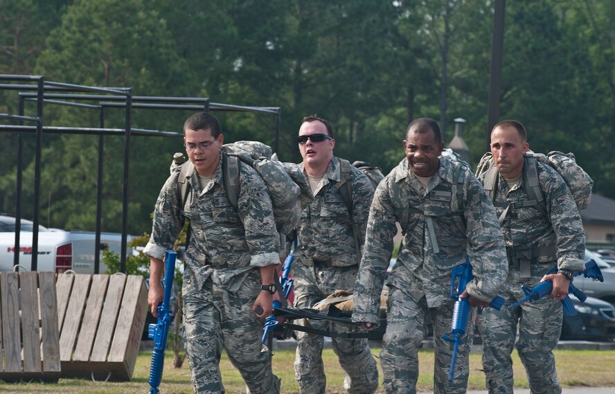 MOODY AIR FORCE BASE, Ga -- Airmen  of the 822nd Base Defense Squadron push through the last portion of the ruck march May 13. The final mile of the ruck march required the team to carry a litter, testing their endurance and teamwork. (U.S. Air Force photo/ Airman 1st Class Jarrod Grammel)(RELEASED)