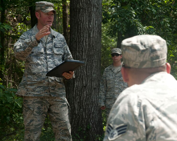 MOODY AIR FORCE BASE, Ga. -- Tech. Sgt. Jason Walden, 822nd Base Defense Squadron, gives a last-minute pep talk to participating teams of a Warrior Challenge May 13. The competition consisted of a breach and extraction scenario geared to test how fast security forces teams could rescue a simulated victim from a hostile building. (U.S. Air Force photo/Airman 1st Class Paul Francis)(RELEASED)