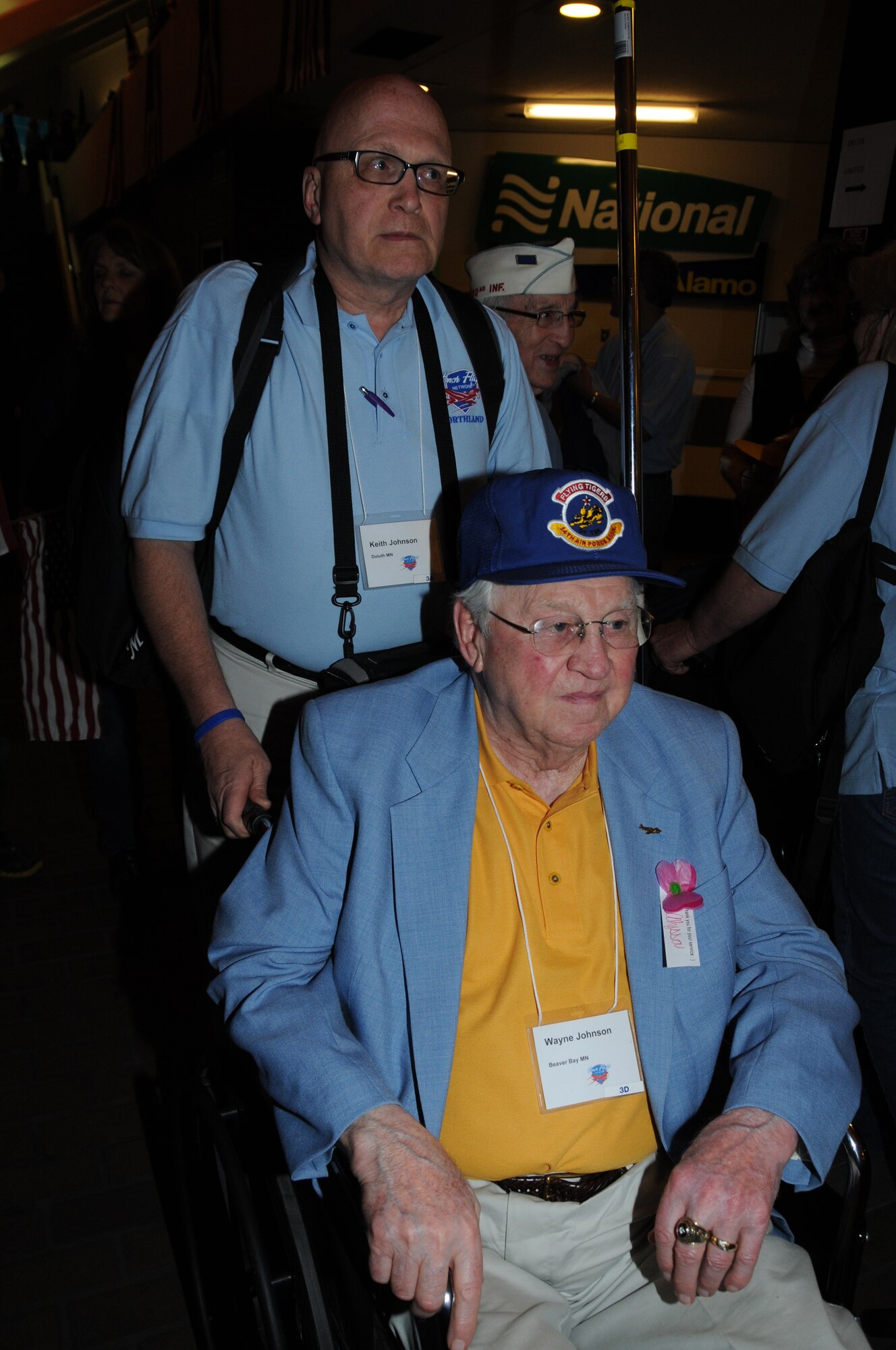Master Sgt. Keith Johnson, 148th Fighter Wing, Duluth, Minn. is seen escorting Col. Wayne Johnson (Retired) after they returned to the Duluth International Airport from Washington D.C.  The two were part of over 100 people that went to D.C. as part of Honor Flight Northland.  (U.S. Air Force photo by Master Sgt. Ralph J. Kapustka)