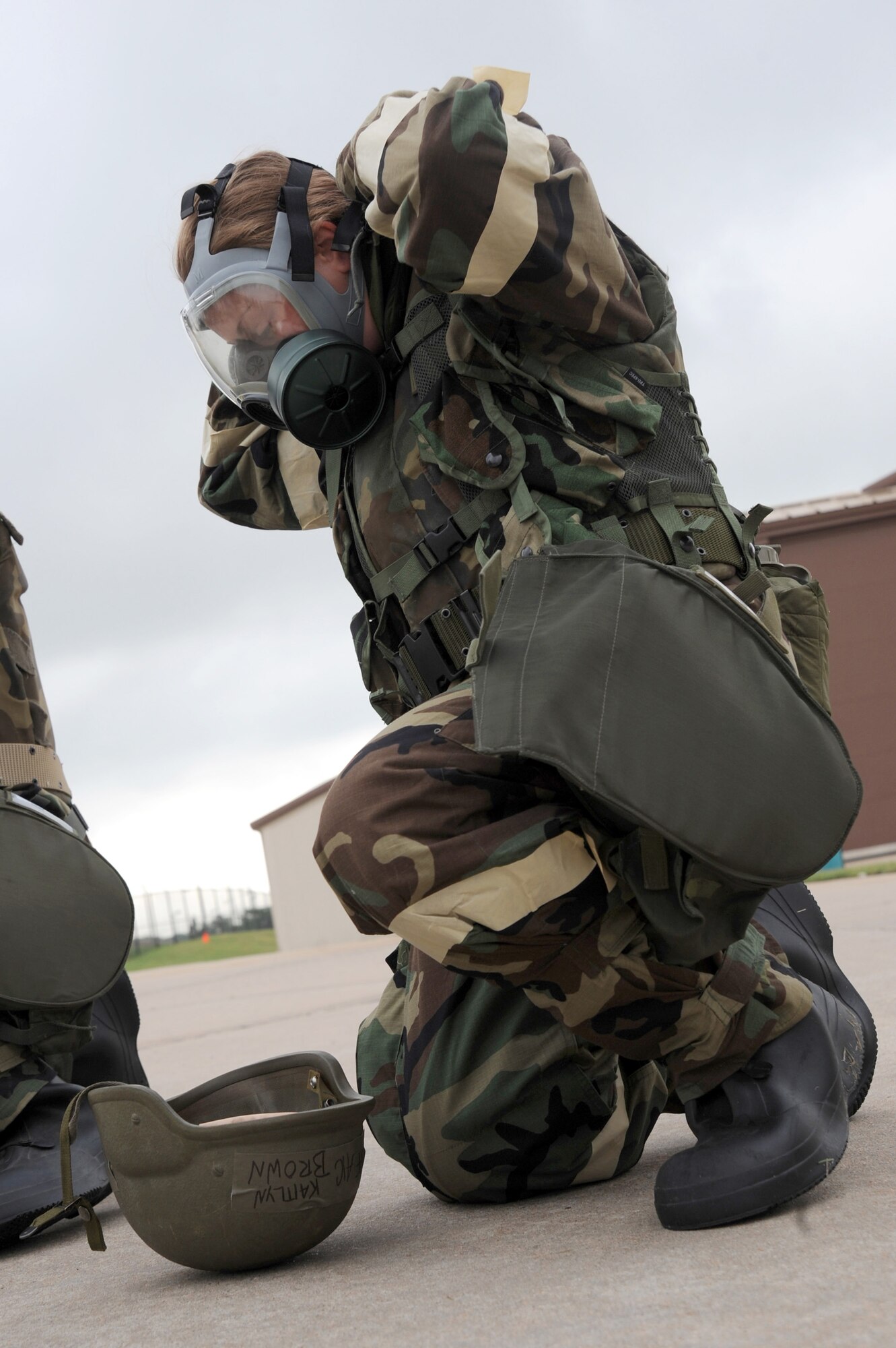 Airman 1st Class Kaitlyn Brown, 931st Air Refueling Group intelligence apprentice, dons a gas mask during an operational readiness exercise May 12, 2011, McConnell Air Force Base, Kan. During the exercise, Airmen demonstrated their ability to complete McConnell’s mission while in chemically contaminated environments. (U.S. Air Force photo/Staff Sgt. Dallas Edwards)