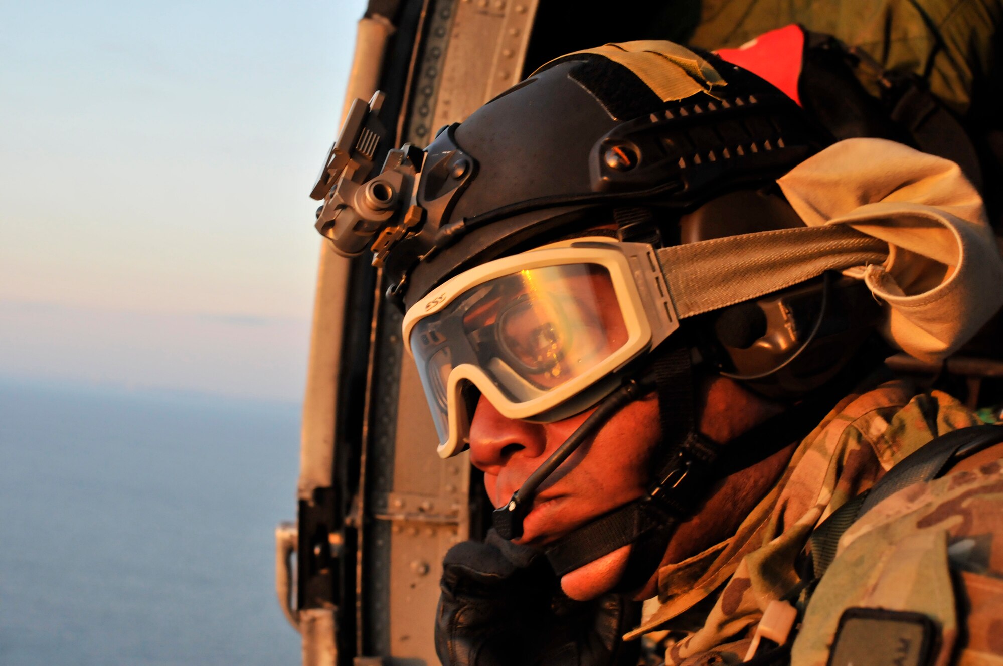PATRICK AIR FORCE BASE, Fla. - Guardian Angel Airmen from the 920th Rescue Wing here, Tech. Sgt. Adrian Durham, pararescueman, is on call for astronaut rescue while he waits and watches aboard a wing HH-60G Pave Hawk helicopter piloted by Rescue Wing Airmen as they fly over the Atlantic coastline past May 16, 2011. Rescue Wing Airmen are tasked as the primary rescue force to respond to the astronauts during manned spaceflight missions. (U.S. Air Force photo/Staff Sgt. Anna-Marie Wyant)