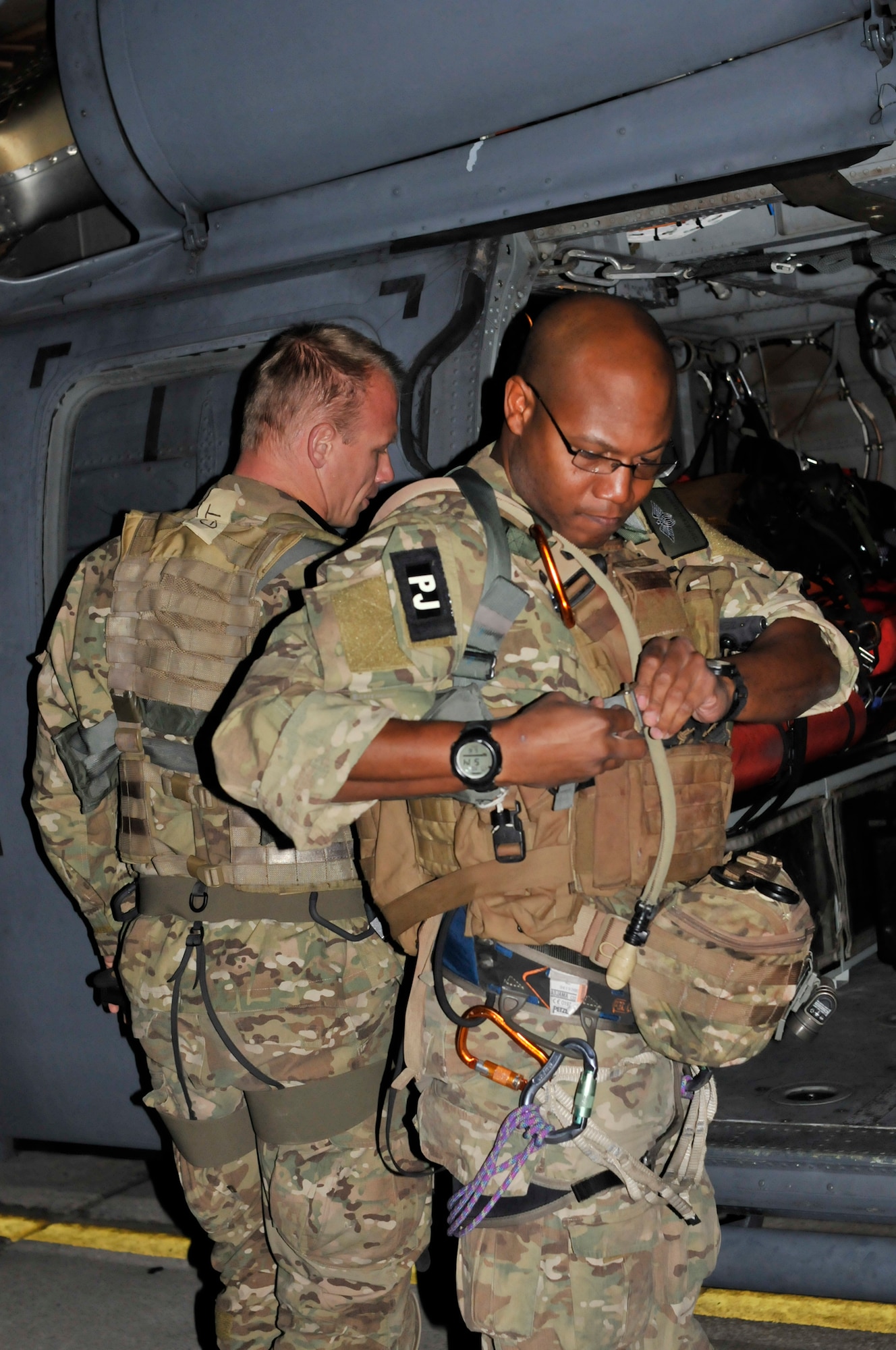 PATRICK AIR FORCE BASE, Fla. - Guardian Angel Weapons System Airmen from the 920th Rescue Wing here, Tech. Sgt. Adrian Durham (Right) and Master Sgt. Jon Grant, pararescuemen, prepare for astronaut rescue prior to boarding an HH-60 Pave Hawk helicopter May 16, 2011 prior to the launch of Space Shuttle Endeavor. (U.S. Air Force photo/Staff Sgt. Anna-Marie Wyant)