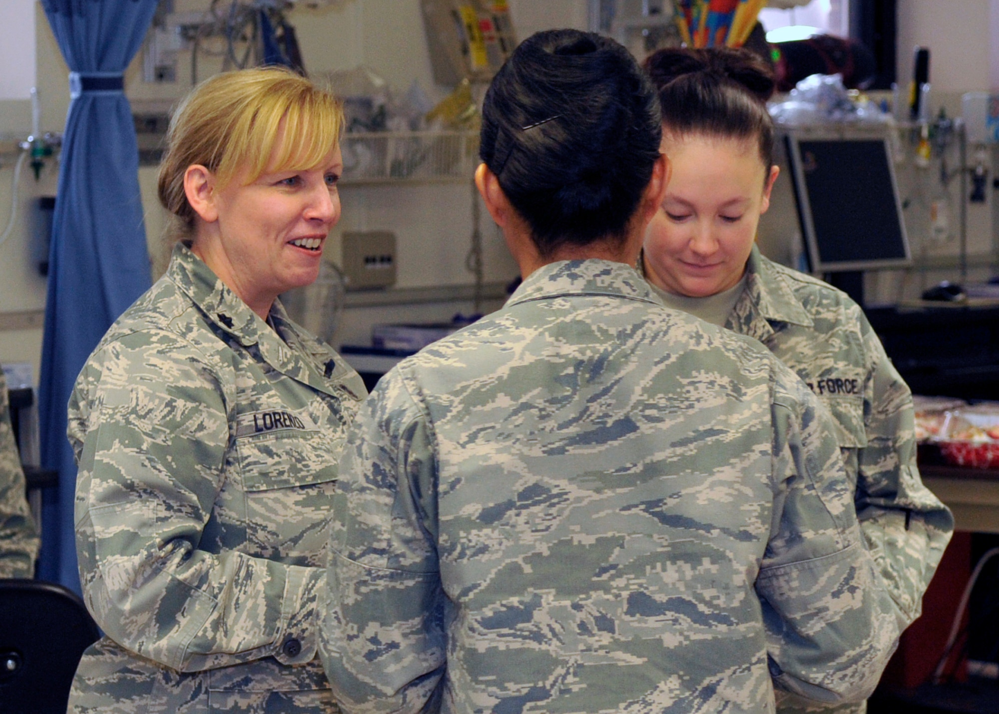 Lieutenant Colonel Kelli Lorenzo, 579th Medical Group Chief Nurse, speaks with fellow nurses from the 779th Medical Group during Nurse/Technician week April 29, 2011. The week ended Thursday, culminating in celebrating the birthday of Florence Nightingale. (U.S. Air Force photo/Senior Airman Laura Turner)