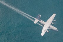 SOMEWHERE OFF THE CALIFORNIA COAST -- The Air Force Reserve's 910th Airlift Wing, the U.S. Coast Guard  and more than 35 other organizations are participating in a multi-agency oil spill response exercise near the San Diego coast, May 11-12, 2011.  A specially-equipped 910th C-130H Hercules cargo aircraft sprays a practice dispersant, actually water, onto the simulated oil spill as part of the response here, May 12, 2011. The 910th AW operates the Department of Defense's only large-area, fixed wing aerial spray capability. Participants in the exercise returned to their various home stations on May 13, 2011. U.S. Air Force photo by Mr. Eric White
