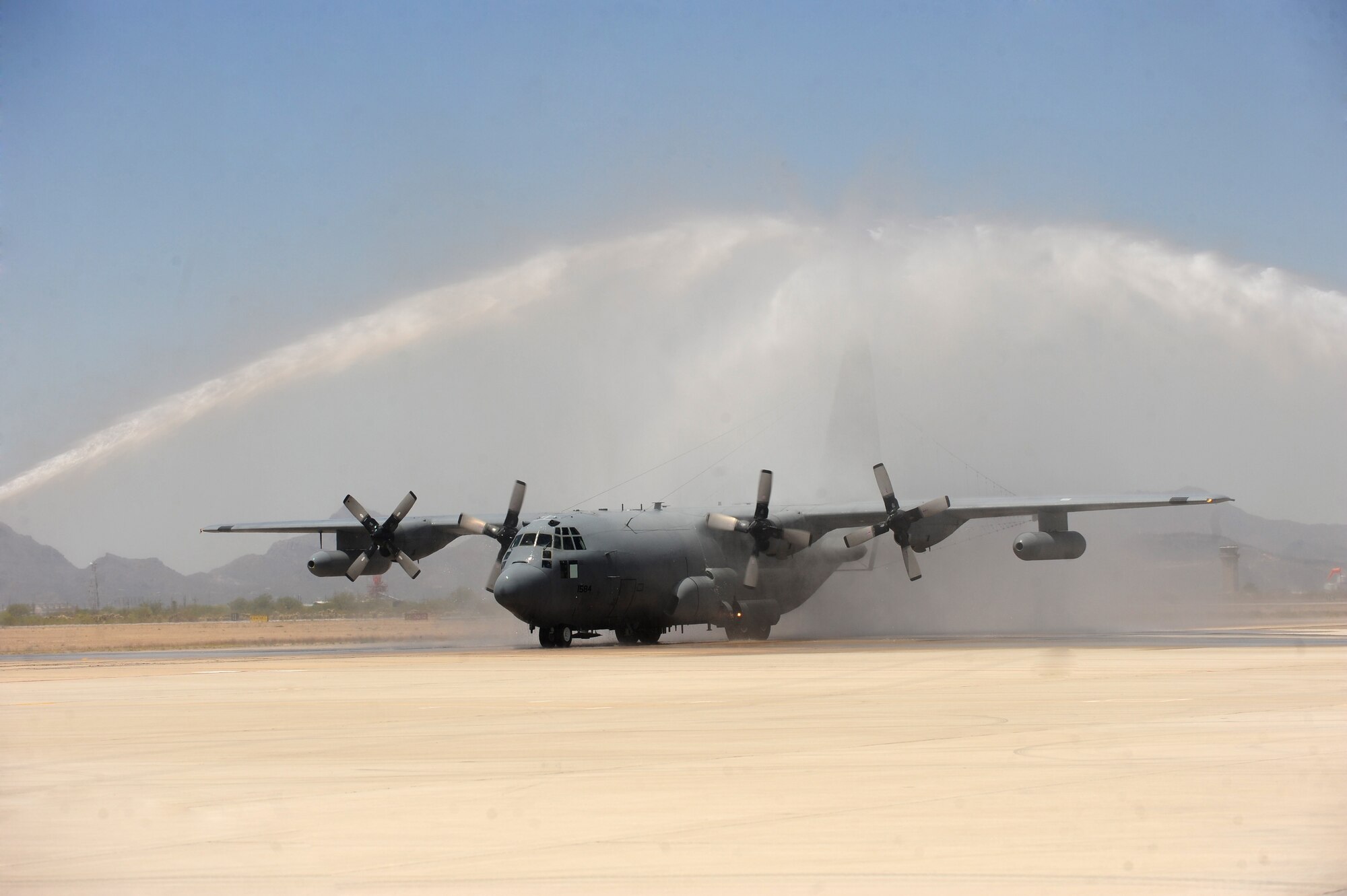 DAVIS-MONTHAN AIR FORCE BASE, Az. -- A 42nd Electronic Combat Squadron EC-130H Compass Call is doused with water symbolizing the fini flight for Lt. Gen. Glenn F. Spears, 12th Air Force commander, here May 6. General Spears served more than 33 years in the Air Force and was a command pilot with more than 3,400 flying hours in 16 types of aircraft. (Air Force photo by Senior Airman Jerilyn Quintanilla, 355th Fighter Wing Public Affairs)