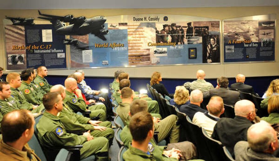 Retired Gen. Duane Cassidy, center, visits with his son, Col. Mike Cassidy, during an 8th Airlift Squadron dedication ceremony honoring General Cassidy at the squadron headquarters May 6, 2011, at Joint Base Lewis-McChord, Wash. (U.S. Army Photo/Ingrid Barrentine) 
