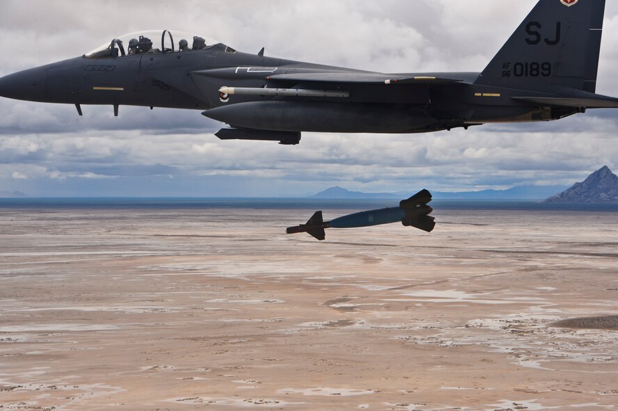 A 4th Fighter Wing F-15E Strike Eagle releases a Guided Bomb Unit-24 over the Utah Test and Training Range during a Combat Hammer mission May 5 near Hill Air Force Base, Utah.  Combat Hammer, an air-to-ground weapons system evaluation program, is maintained by the 86th Fighter Weapons Squadron. The WSEP program is used to evaluate the effectiveness and suitability of combat air force weapon systems. The evaluations are accomplished during tactical deliveries of fighter, bomber and unmanned aerial system precision guided munitions, on realistic targets with air-to-air and surface-to-air defenses. For many of the aircrew participating in WSEP, it is the first time employing live weapons. This provides a level of combat experience many units face during combat.  (Courtesy photo)