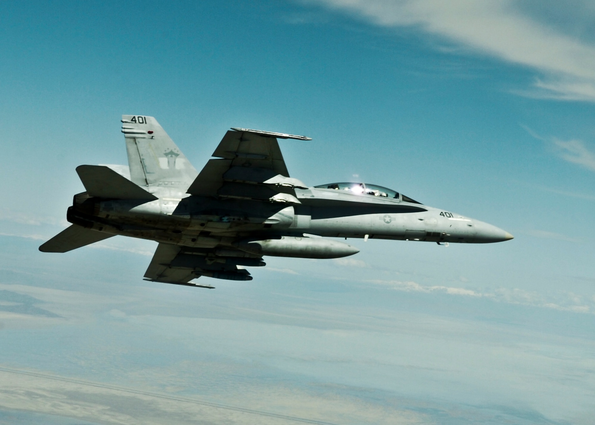An F-18A Hornet soars above the Utah Test and Training Range during a Combat Hammer mission May 11 near Hill Air Force Base, Utah.  Combat Hammer, an air-to-ground weapons system evaluation program, is maintained by the 86th Fighter Weapons Squadron. The WSEP program is used to evaluate the effectiveness and suitability of combat air force weapon systems. The evaluations are accomplished during tactical deliveries of fighter, bomber and unmanned aerial system precision guided munitions, on realistic targets with air-to-air and surface-to-air defenses. For many of the aircrew participating in WSEP, it is the first time employing live weapons. This provides a level of combat experience many units face during combat.  (Courtesy photo)