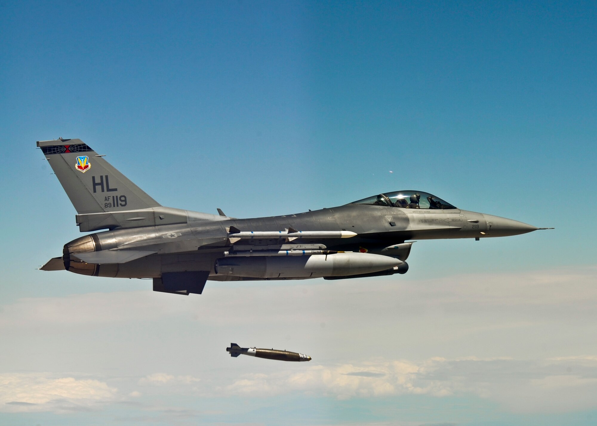 An F-16 Fighting Falcon from Hill Air Force Base, Utah, releases a Guided Bomb Unit-31 during a Combat Hammer mission May 11 at Hill.  Combat Hammer, an air-to-ground weapons system evaluation program, is maintained by the 86th Fighter Weapons Squadron. The WSEP program is used to evaluate the effectiveness and suitability of combat air force weapon systems. The evaluations are accomplished during tactical deliveries of fighter, bomber and unmanned aerial system precision guided munitions, on realistic targets with air-to-air and surface-to-air defenses. For many of the aircrew participating in WSEP, it is the first time employing live weapons. This provides a level of combat experience many units face during combat.  (Courtesy photo)