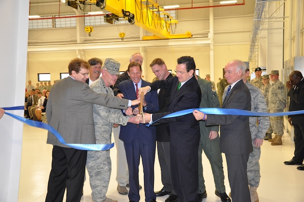 Plenty of help was available to cut the ribbon following the ceremony April 28, 2011, to mark the official opening of the Centralized Repair Facility at Bradley Air National Guard Base, East Granby, Conn . The $8.3 million dollar project improves and expands the existing TF-34 Engine repair facility, adding an additional 17,000 square feet. (Photo by Sgt. 1st Class Debbi Newton, State Public Affairs NCO)