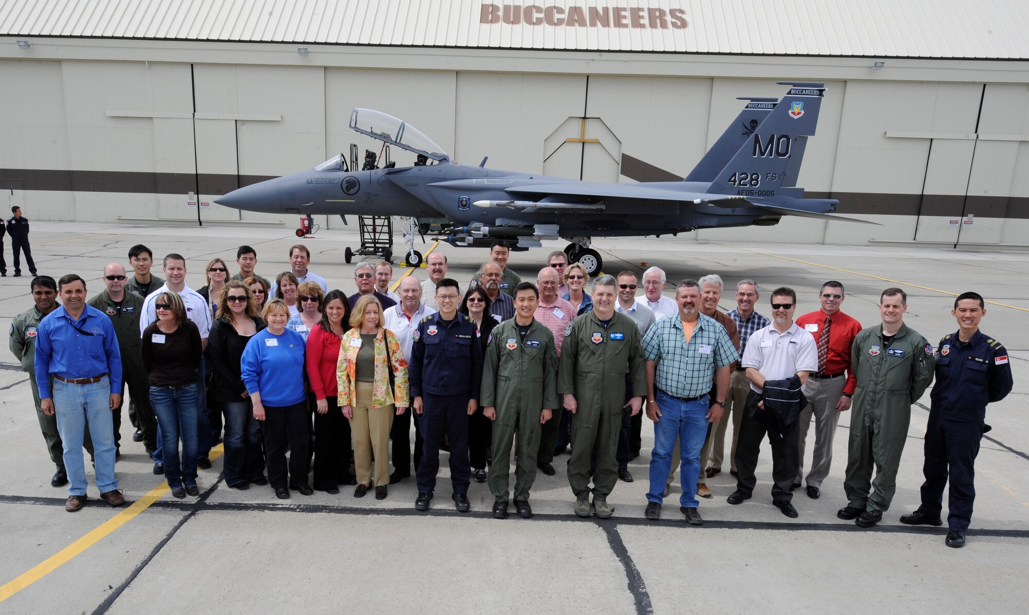 MOUNTAIN HOME AIR FORCE BASE, Idaho – The Military Affairs Committee pauses for a group photo with members of the 428th fighter squadron May 6. While at the 428th, each MAC member was given the opportunity to climb inside the cockpit of a F-15SG Eagle. (U.S. Air Force photo by Angelina Drake)