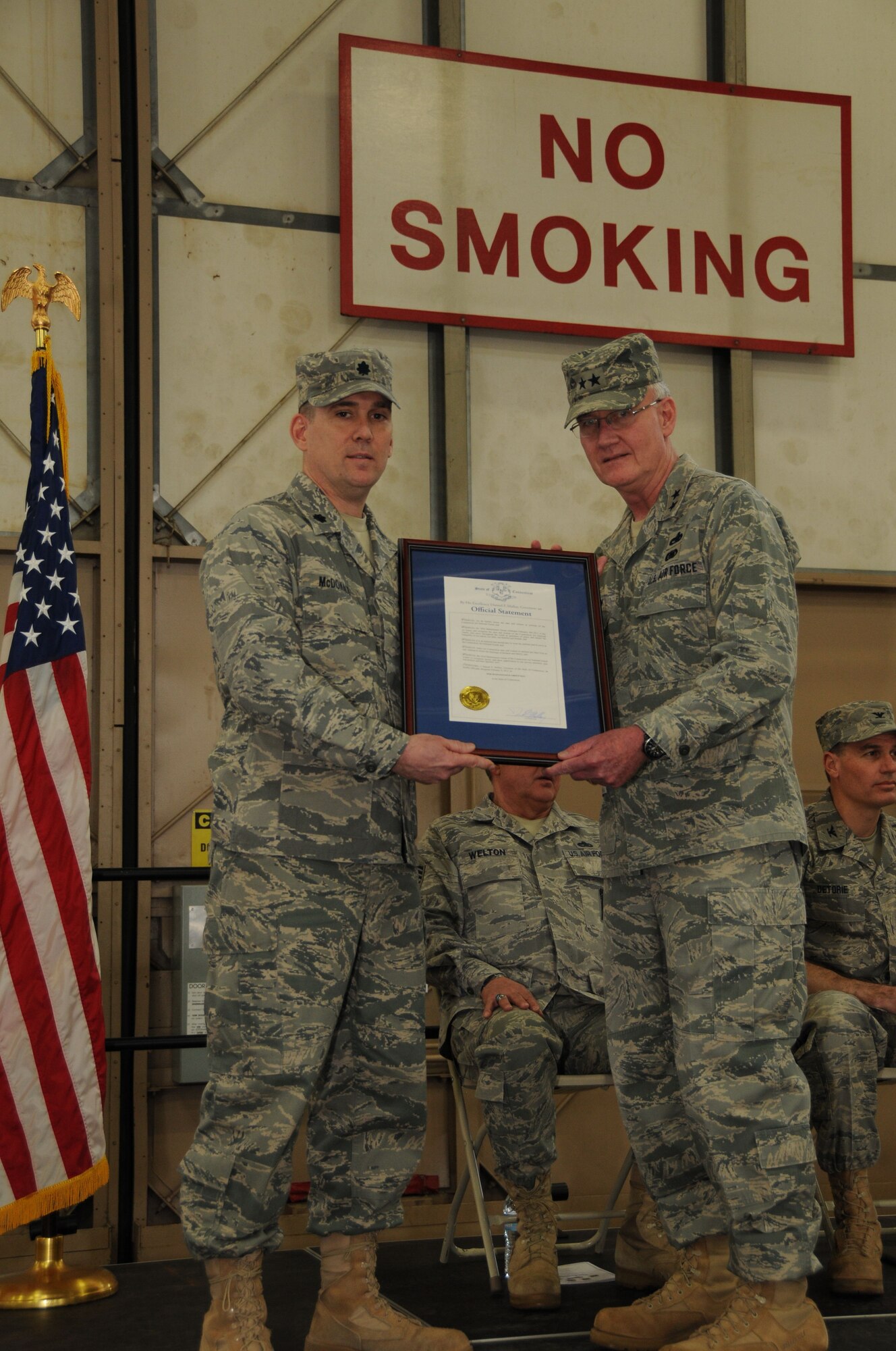 Lt. Col. Gerald McDonald, 103rd Maintenance Group Commander, and Maj. Gen. Thaddeus J. Martin, The Adjutant General and commander of the Connecticut National Guard, hold up an official statement from Conn. Gov. Dannel P. Malloy during the annual maintenance group awards ceremony April 17, 2011, at Bradley Air National Guard Base, East Granby, Conn. The document designated Feb. 6, 2011, as 103rd Maintenance Group Day in the state of Connecticut. (U.S. Air Force photo by Tech. Sgt. Tedd Andrews)