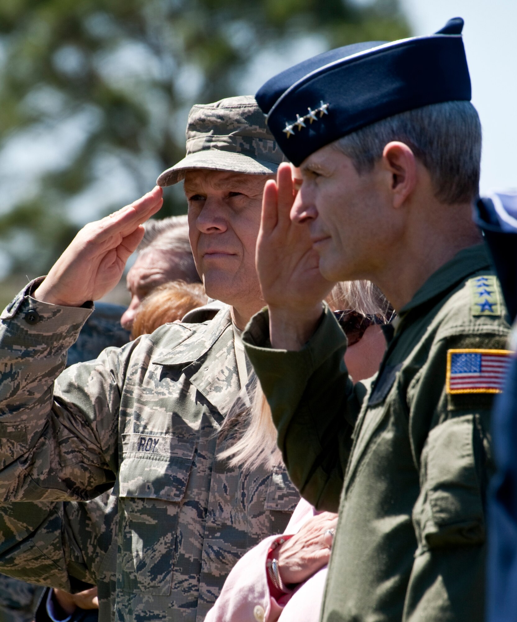 Air Force Chief of Staff Gen. Norton Schwartz and Chief Master Sgt. of the Air Force James A. Roy salute the colors during the national anthem at an MC-130E Combat Talon dedication ceremony May 6, 2011, at Hurlburt Field, Fla. Chief Roy and General Schwartz, a former wing commander and Talon pilot at Hurlburt Field, saw the aircraft honored in its final resting place at the base's airpark. The Talon, known as "Wild Thing" around the 919th Special Operations Wing, made its final flight May 7, 2010, completing 21,336.5 hours of flight. (U.S. Air Force photo/Tech. Sgt. Samuel King Jr.) 