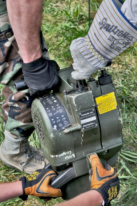 GEROLSTEIN, Germany – Airmen from the 606th Air Control Squadron, use a Pionjar 120 jackhammer to anchor an antenna in the ground to prevent it from falling over as part of exercise Eifel Thunder 2011 in Gerolstein, Germany, May 9. The exercise tested the ability of Airmen to take all their equipment to an isolated location where they set up a deployed radar and satellite communications site as well as everything else required to survive and accomplish the mission in an isolated environment. (U.S. Air Force photo/Senior Airman Nick Wilson)