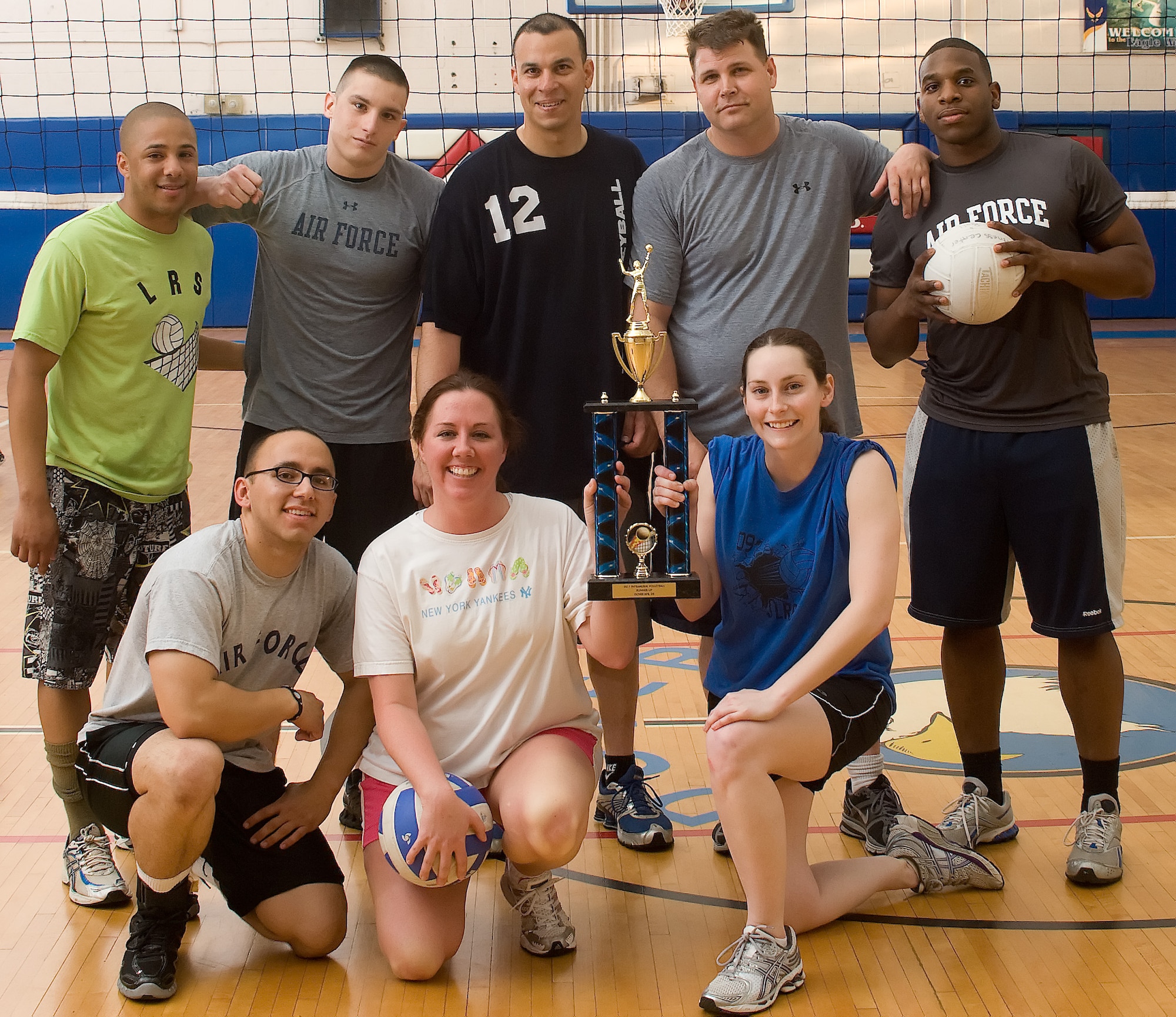 The 436th Logisistics Readiness Squadron team poses with their trophy after the volleyball championship May 11, 2011, at the Dover Air Force Base, Del., Fitness Center. The 436 LRS team was defeated by the 736th Aircraft Maintenance Squadron team after three games with a final match score of 10-15. (U.S. Air Force photo by Airman 1st Class Matthew Hubby)