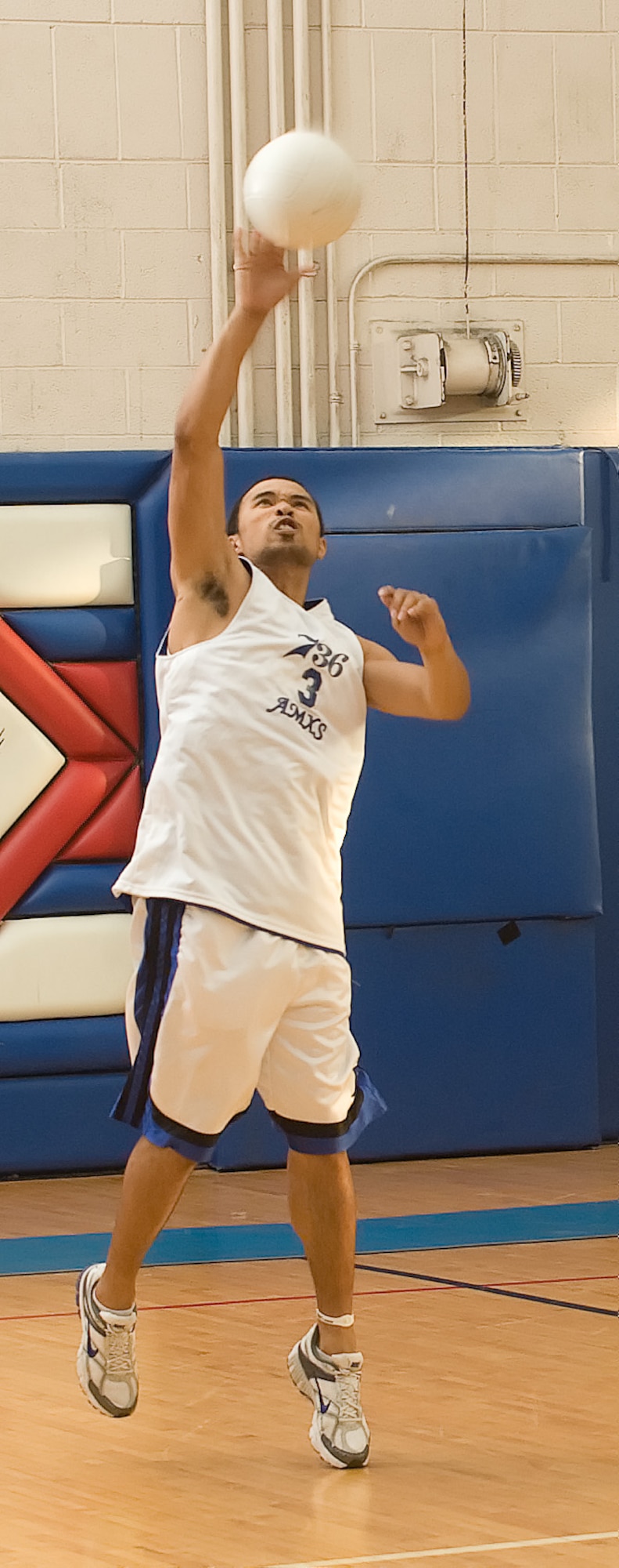 Jason Jones, 736th Aircraft Maintenance Squadron, serves the ball during the volleyball championship game May 11, 2011, at the Dover Air Force Base, Del., Fitness Center. The 736 AMXS team was victorious over the 436th Logistics Readiness Squadron in the final game of the three match championship game 15-10. (U.S. Air Force photo by Airman 1st Class Matthew Hubby)