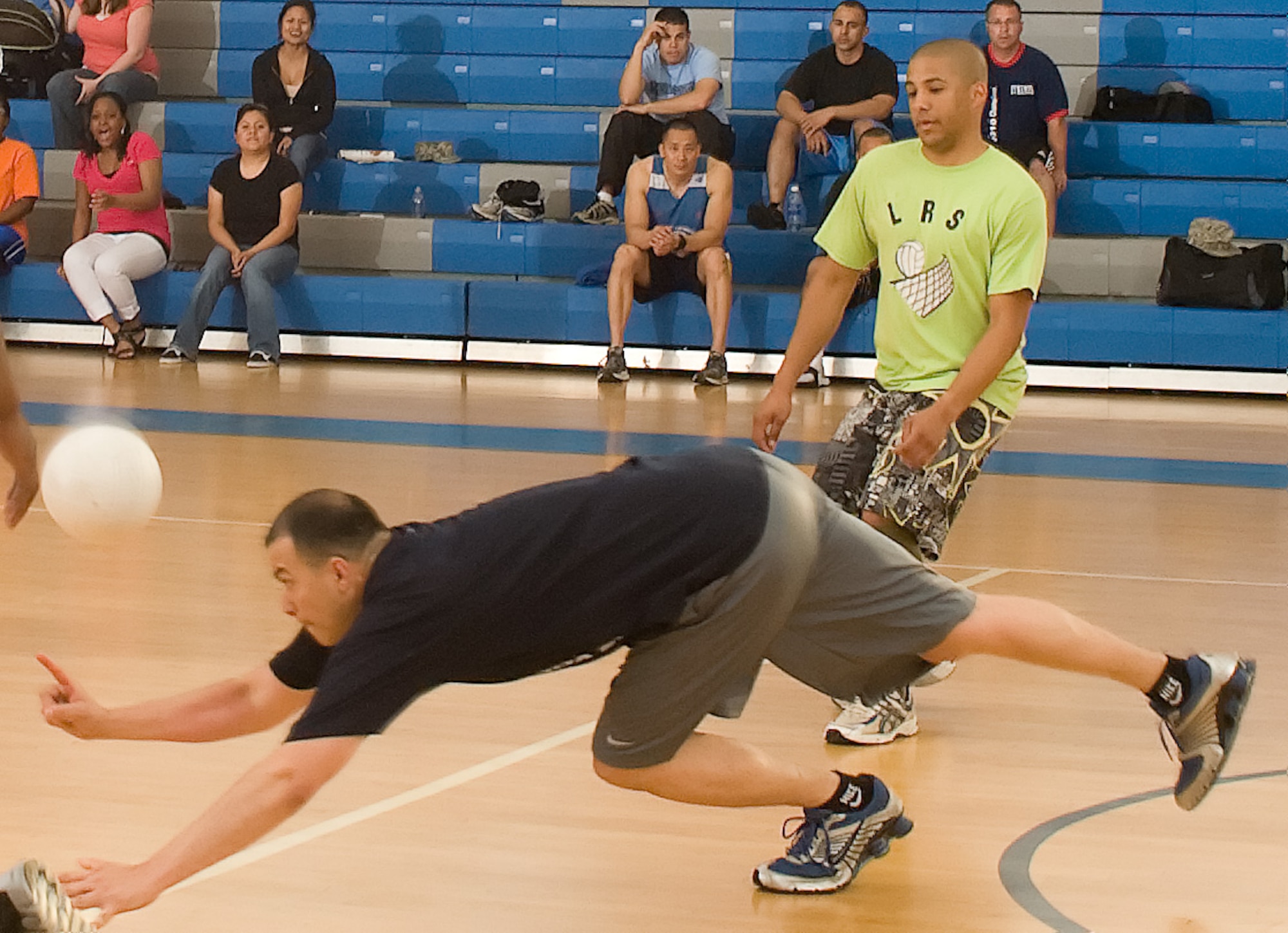 David Valentin Ruiz dives for the volleyball during the volleyball championship game May 11, 2011, at the Dover Air Force Base, Del., Fitness Center. Sergeant Valentine Ruiz played for the 436th Logistics Readiness Squadron, which lost its final game against the 736th Aircraft Maintenance Squadron 10-15. (U.S. Air Force photo by Airman 1st Class Matthew Hubby)