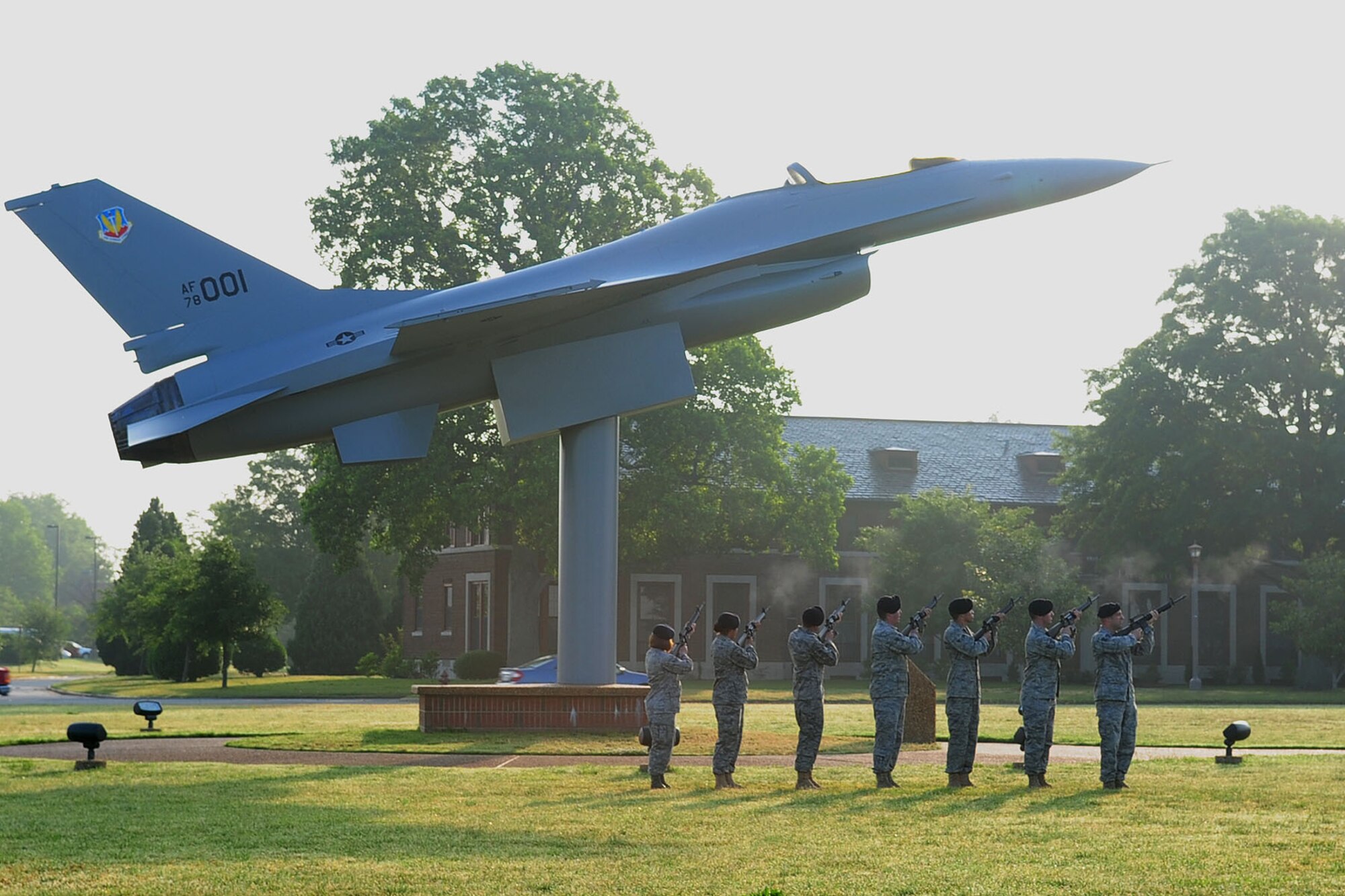 Members of the 633d Security Forces Squadron render a twenty-one gun salute during the Police Officers' Memorial ceremony at Langley Air Force Base, Va., May 16, 2011. Military and civilian defenders from the Hampton Roads area came together to recognize May 15th as Police Officer Memorial Day and remember those who were killed in action. (U.S. Air Force photo by Staff Sgt. Ashley Hawkins)(RELEASED)
