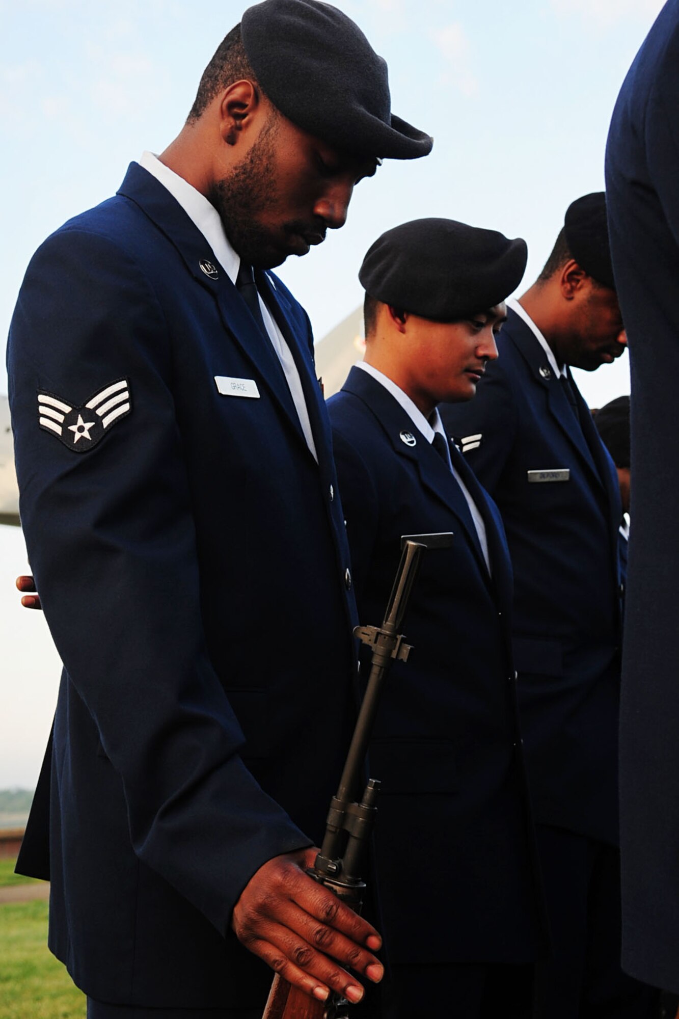 Members of the 633d Security Forces Squadron observe a moment of silence during the Police Officers' Memorial ceremony at Langley Air Force Base, Va., May 16, 2011. The ceremony was held to observe May 15th as Police Officer Memorial Day and to celebrate National Police Week. (U.S. Air Force photo by Staff Sgt. Ashley Hawkins)(RELEASED)