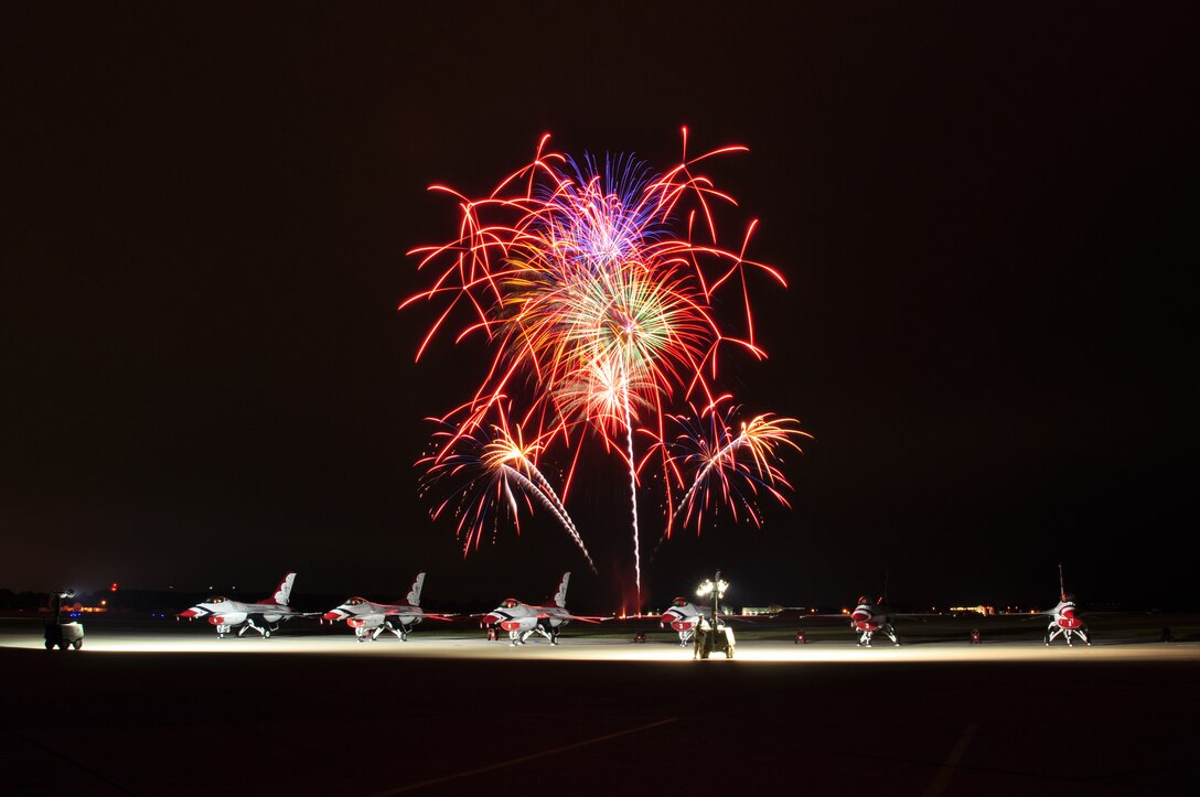 Fireworks bloom above parked Thunderbirds during Air Power over Hampton Roads open house at Langley Air Force Base, Va., May 13, 2011. The U.S. Air Force Thunderbirds headlined the open house and performed precision aerial maneuvers, demonstrating the capabilities of high performance aircraft to the Hampton Roads area. (U.S. Air Force photo by Senior Airman Jonathan Muller)(RELEASED)