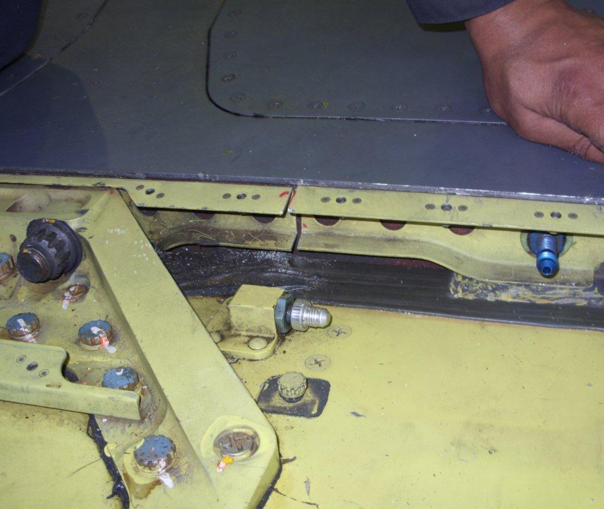 SPANGDAHLEM AIR BASE, Germany – An incision is made to remove the root bracket from an F-16 Fighting Falcon wing. The 52nd Equipment Maintenance Squadron Fabrication Flight Aircraft Structures Maintenance Shop recently began a new process for replacing the root brackets on F-16 wings. The process reduces the man hours it takes to perform the repair from 522 to 26 man hours. (Courtesy photo)