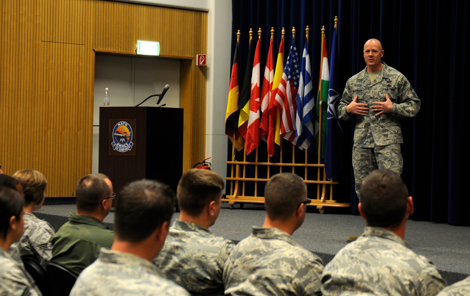 NATO AIR BASE GEILENKIRCHEN, Germany – Chief Master Sgt. David Williamson, U.S. Air Forces in Europe command chief, speaks to Airmen from the 470th Air Base Squadron at the base theater here May 11. Chief Williamson visited various facilities at NATO Air Base Geilenkirchen to gain a better understanding of the base’s mission and to observe mission resources. (U.S. Air Force photo/Airman 1st Class Brittney Frees)